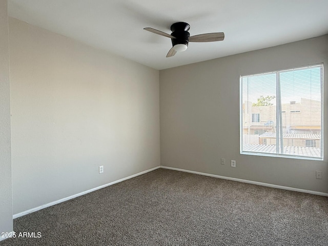 3840 N 43rd Ave Unit 34, Phoenix, AZ 85031 - empty room featuring carpet, a ceiling fan, and baseboards