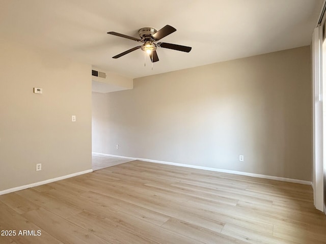 3840 N 43rd Ave Unit 34, Phoenix, AZ 85031 - empty room featuring ceiling fan, light wood-style floors, and baseboards