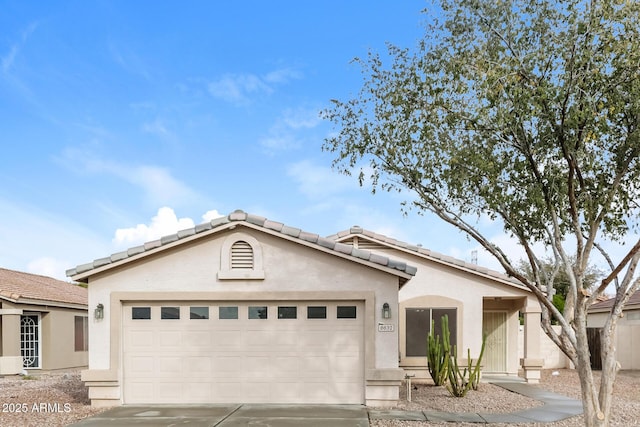 8832 W Manzanita Dr, Peoria, AZ 85345 - view of front facade with driveway, an attached garage, a tile roof, and stucco siding