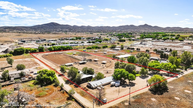 birds eye view of property with a mountain view