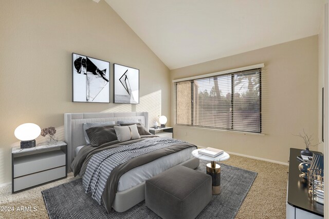 bedroom featuring lofted ceiling and carpet floors