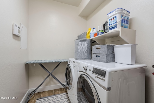 washroom with independent washer and dryer