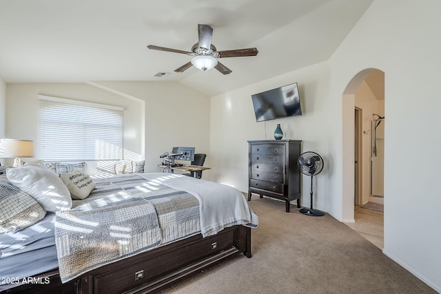 carpeted bedroom with ceiling fan and vaulted ceiling