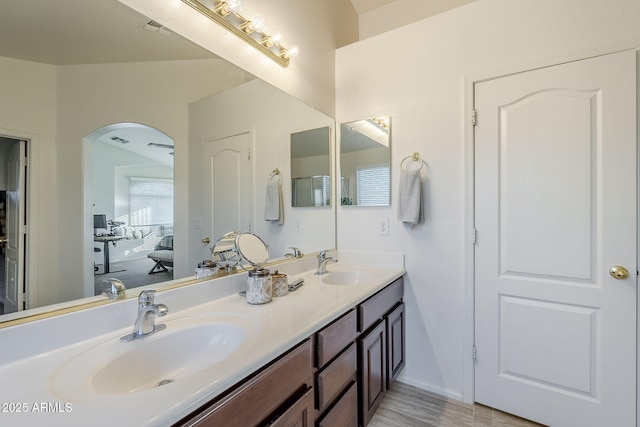 bathroom with wood-type flooring and vanity