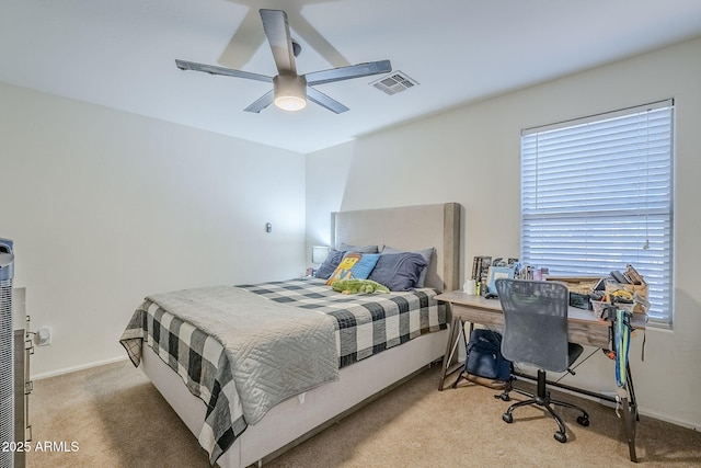 carpeted bedroom with ceiling fan