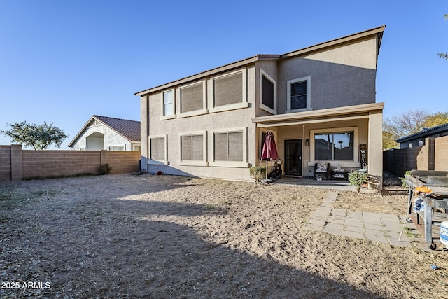 rear view of house with a patio