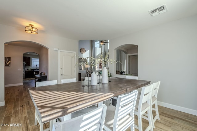 dining area featuring ceiling fan and hardwood / wood-style floors