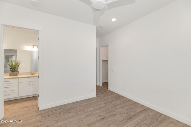 unfurnished bedroom with ceiling fan, ensuite bathroom, recessed lighting, baseboards, and light wood-style floors