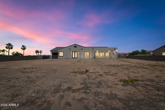 rear view of house with fence