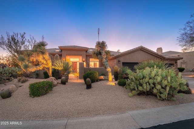 28768 N 95th Way, Scottsdale, AZ 85262 - mediterranean / spanish house featuring a garage, a tile roof, stucco siding, and a chimney