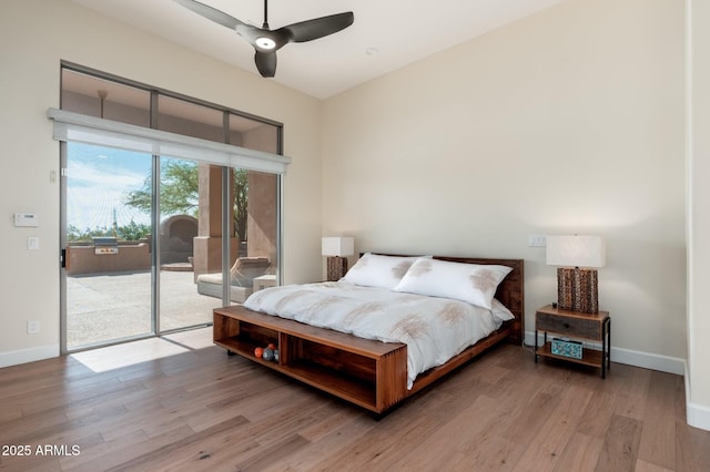 28768 N 95th Way, Scottsdale, AZ 85262 - bedroom with access to exterior, wood finished floors, and ceiling fan