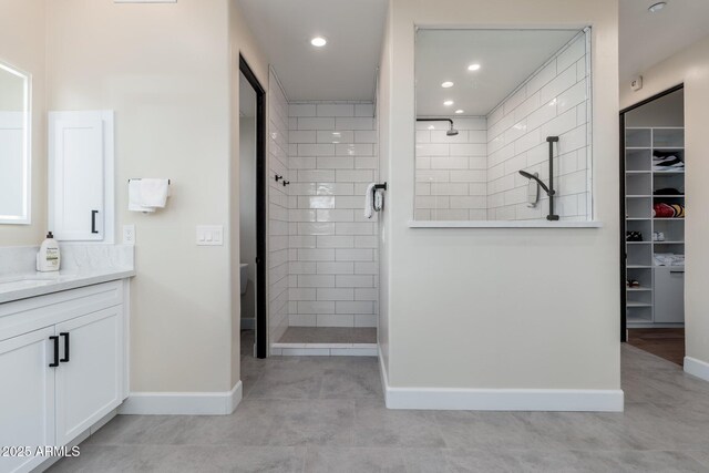 28768 N 95th Way, Scottsdale, AZ 85262 - bathroom featuring vanity, tiled shower, a walk in closet, recessed lighting, and tile patterned flooring