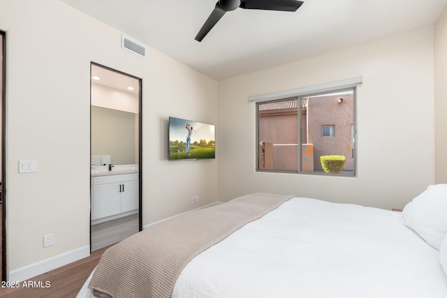 28768 N 95th Way, Scottsdale, AZ 85262 - bedroom with wood finished floors, ensuite bath, and ceiling fan
