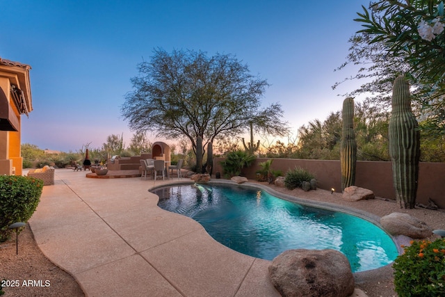 28768 N 95th Way, Scottsdale, AZ 85262 - pool at dusk with a patio area and a fenced backyard