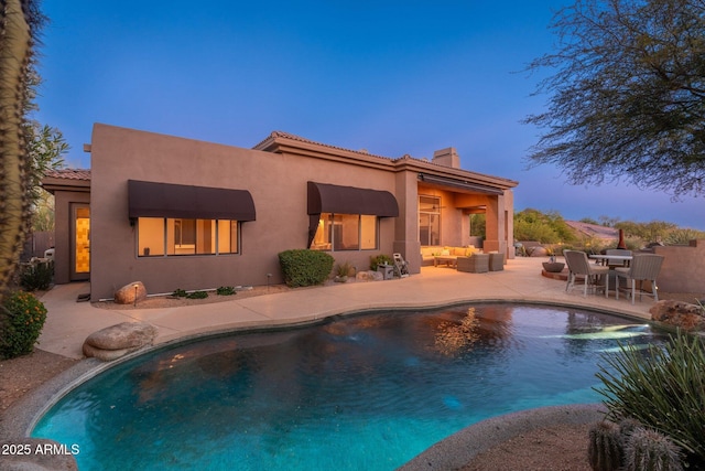 28768 N 95th Way, Scottsdale, AZ 85262 - rear view of property with outdoor lounge area, a patio, a chimney, stucco siding, and an outdoor pool