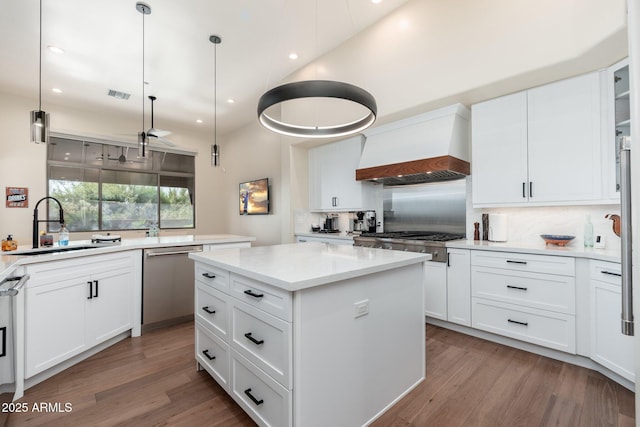 28768 N 95th Way, Scottsdale, AZ 85262 - kitchen with premium range hood, stainless steel appliances, a kitchen island, backsplash, and recessed lighting