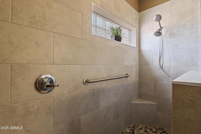 bathroom with tiled shower