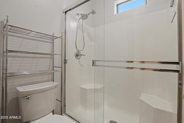 full bath with toilet and a stall shower