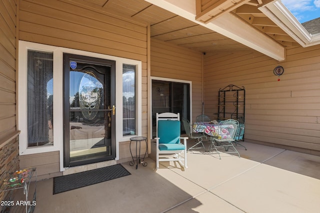 doorway to property with a patio area