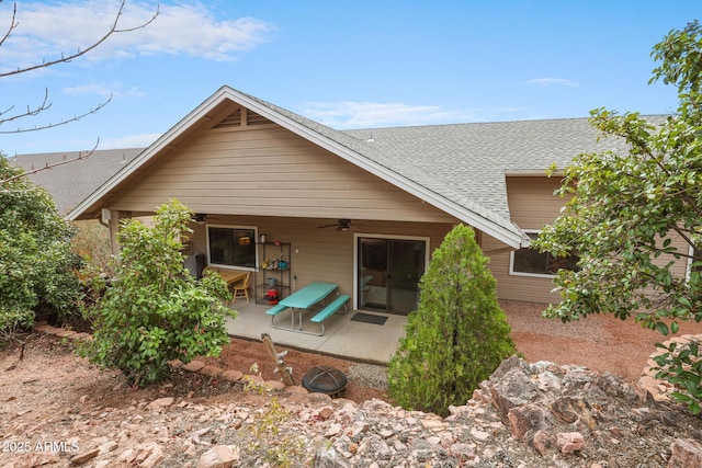 rear view of house featuring a patio, roof with shingles, and a ceiling fan