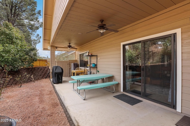 view of patio / terrace with a ceiling fan, fence, and area for grilling