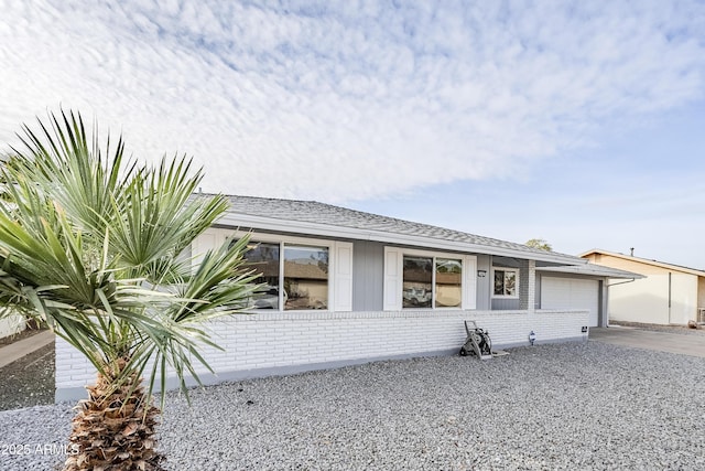 ranch-style house featuring a garage