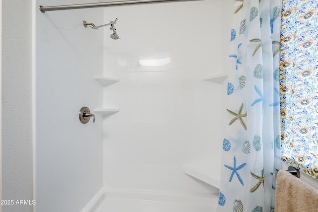 bathroom featuring a shower with curtain