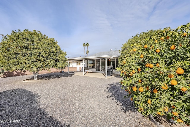 back of property featuring a patio