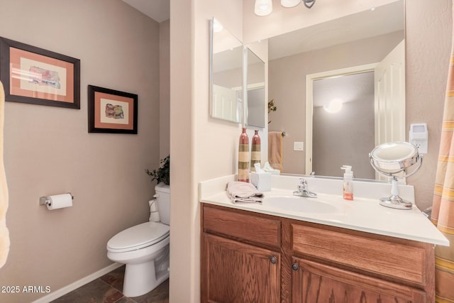 bathroom featuring tile patterned flooring, vanity, and toilet