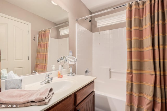 bathroom with vanity and shower / tub combo