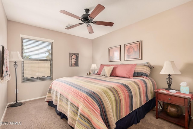 bedroom featuring light carpet and ceiling fan