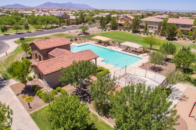 view of swimming pool featuring a mountain view and a patio area