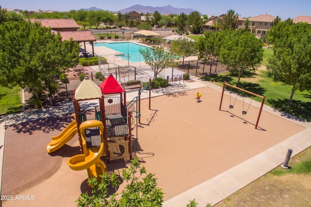 exterior space featuring a mountain view and a playground