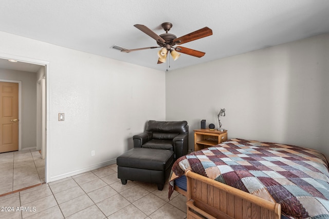 tiled bedroom with ceiling fan