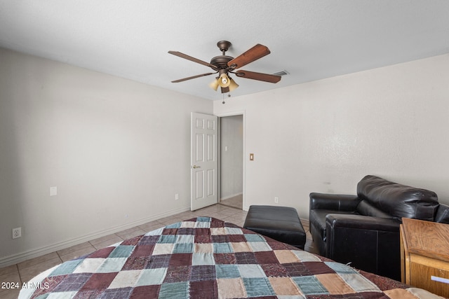 unfurnished bedroom featuring ceiling fan and light tile patterned flooring