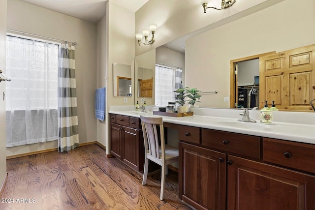 bathroom featuring vanity and hardwood / wood-style floors