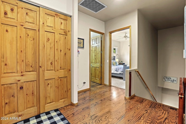 hallway with wood-type flooring