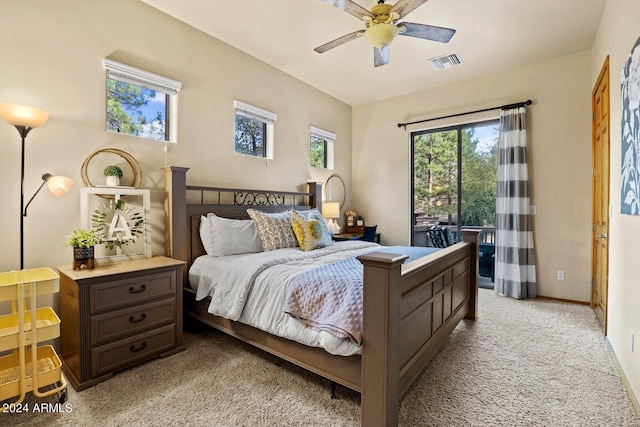 bedroom featuring light carpet, access to exterior, and ceiling fan