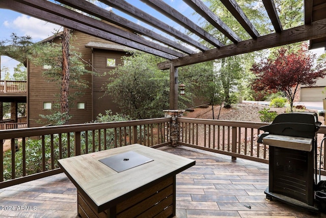 deck featuring area for grilling and a pergola