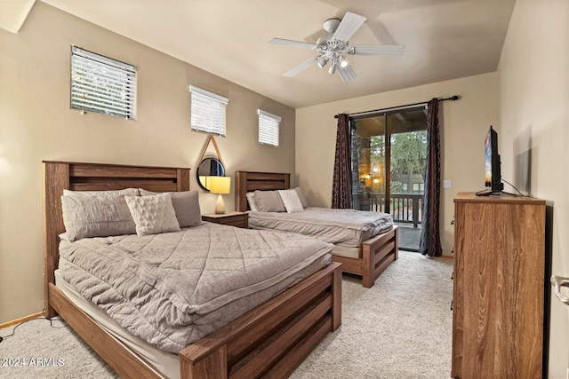 carpeted bedroom featuring access to exterior and ceiling fan