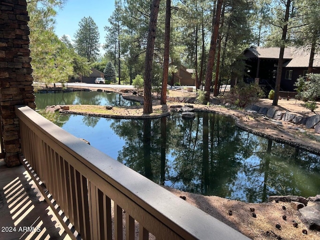 view of swimming pool featuring a water view