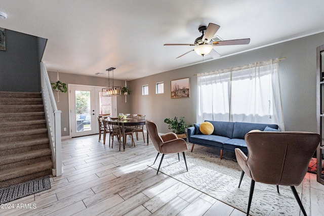 living room with ceiling fan and french doors