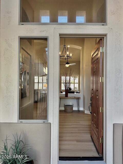 property entrance featuring ceiling fan