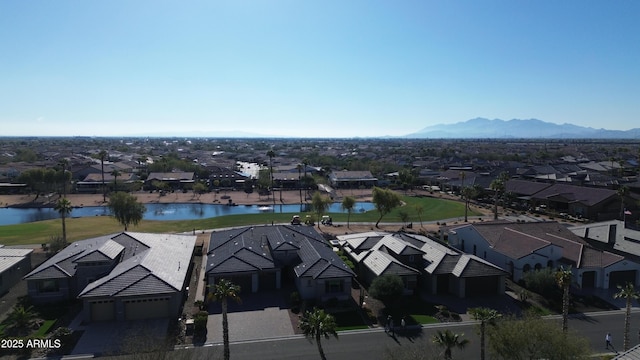 drone / aerial view with a residential view and a water and mountain view