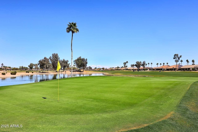 surrounding community featuring a water view