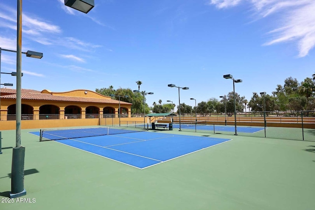 view of sport court featuring fence