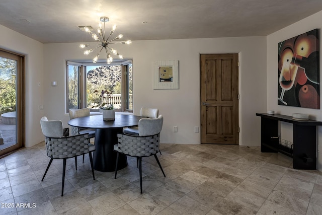 dining room featuring a healthy amount of sunlight and a chandelier