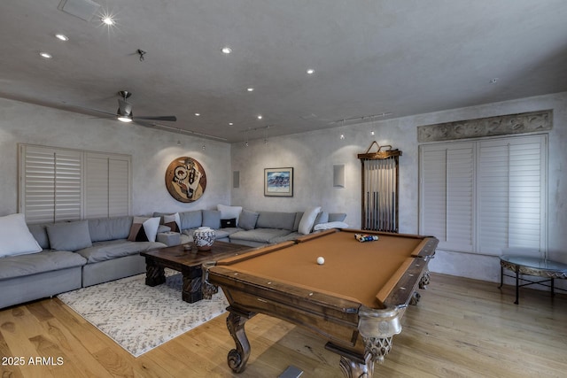 recreation room with ceiling fan, billiards, and light hardwood / wood-style floors