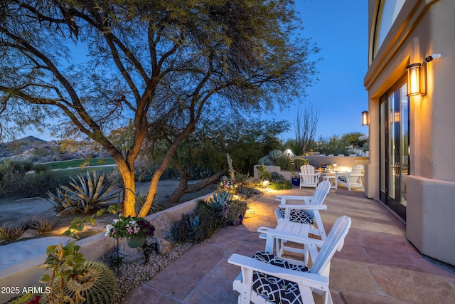 patio terrace at dusk with a mountain view