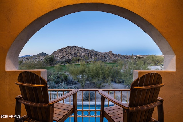 balcony with a water and mountain view